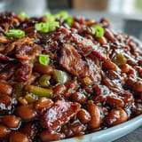 Savory molasses baked beans with crispy bacon, a classic Southern side dish.