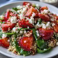 Strawberry Feta Quinoa Salad with Balsamic dressing, featuring fresh strawberries, creamy feta, and hearty quinoa tossed in a tangy vinaigrette.  